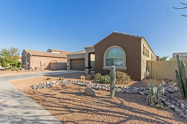 a view of a house with a bench