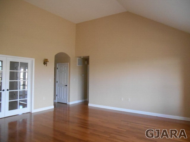 2264 L Road Grand Junction, CO 81505 - Photo 17 of 20 a view of an empty room with wooden floor and windows