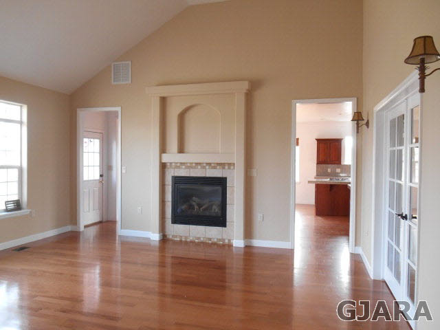 2264 L Road Grand Junction, CO 81505 - Photo 2 of 20 a view of a livingroom with wooden floor and a fireplace