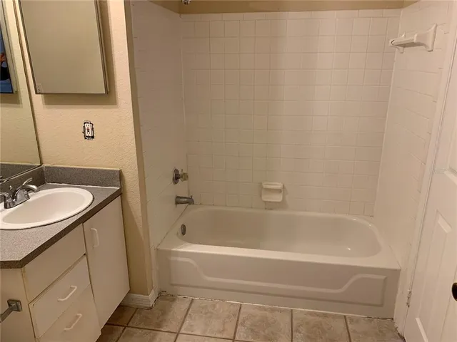 a bathroom with a sink and a bathtub