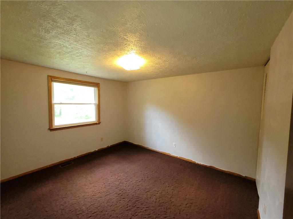 129 Crosslands Road Butler, PA 16002 - Photo 18 of 25 an empty room with a window