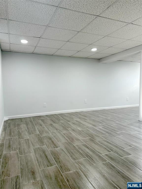 678 Grove Street Ridgewood, NJ 07450 - Photo 10 of 14 an empty room with wooden floor and fan
