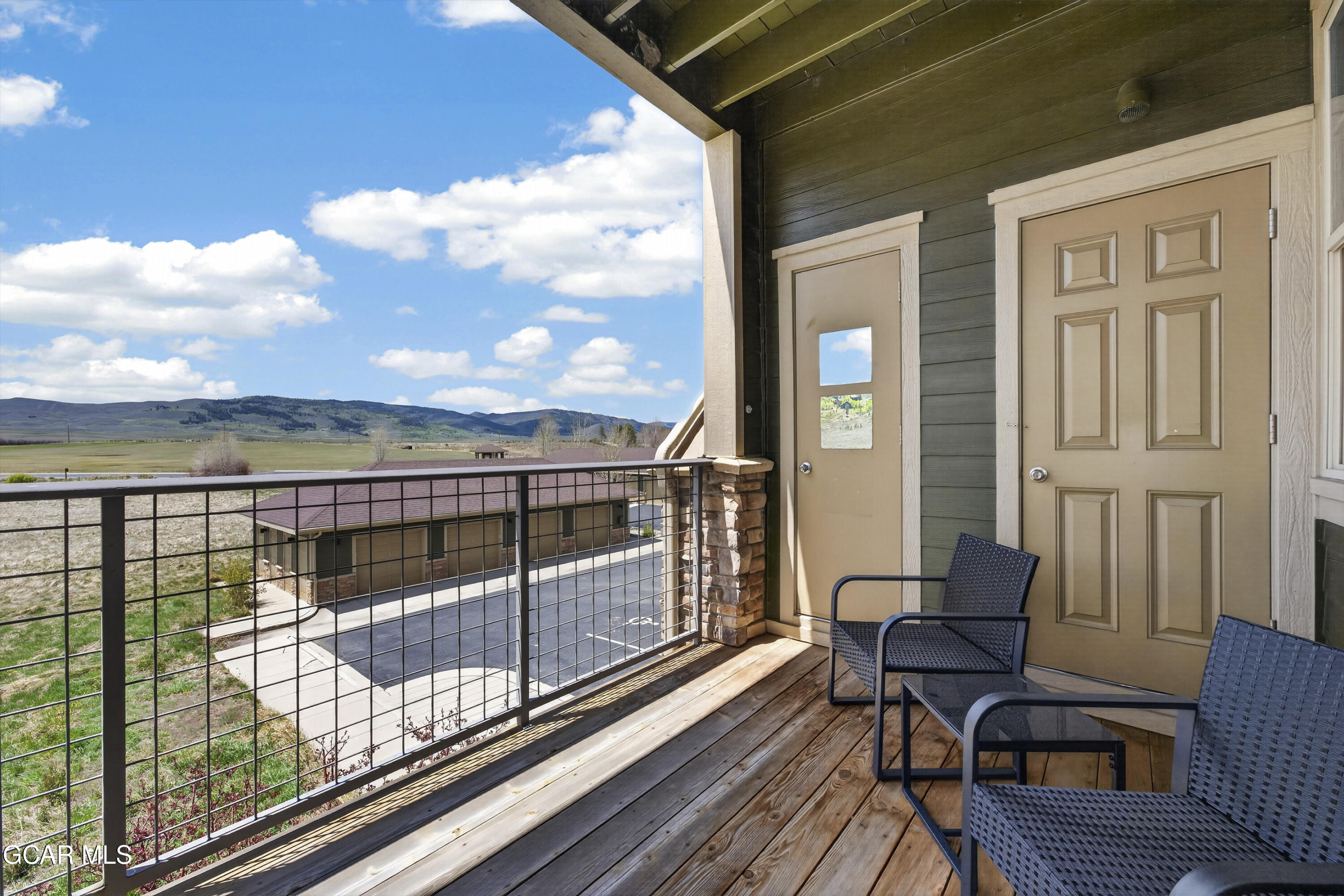 160 Village Road, Unit F207 Granby, CO 80446 - Photo 18 of 28 a view of a balcony with wooden floor