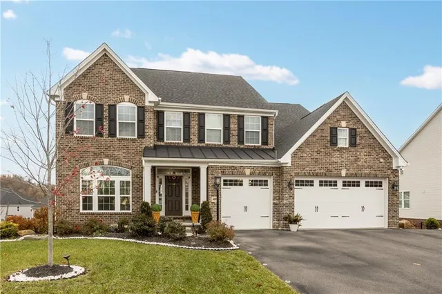 front view of a house with a yard
