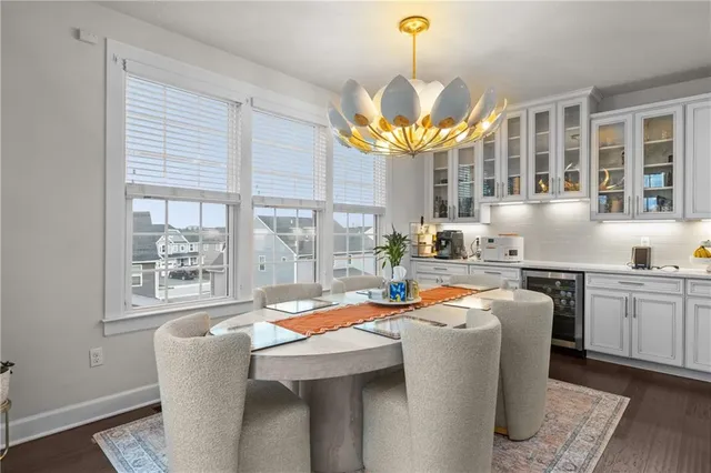 a dining hall with furniture and chandelier