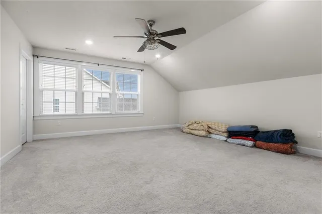 an empty room with air conditioner and windows