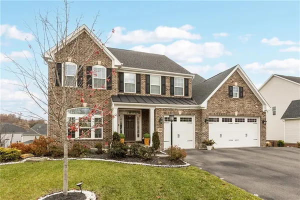front view of a house with a yard
