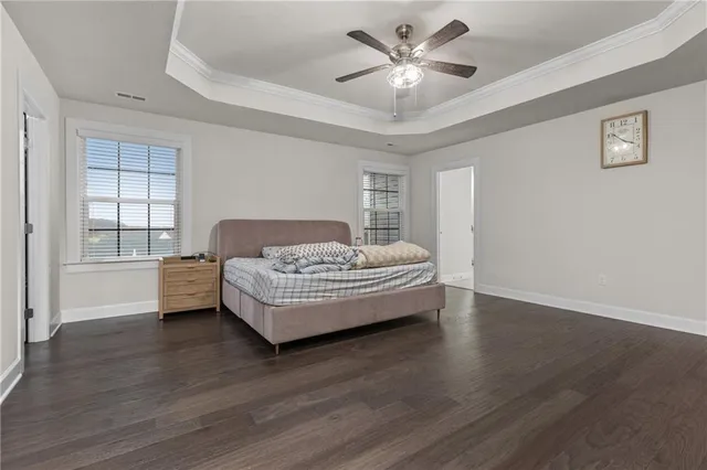 a living room with a bed furniture and a window