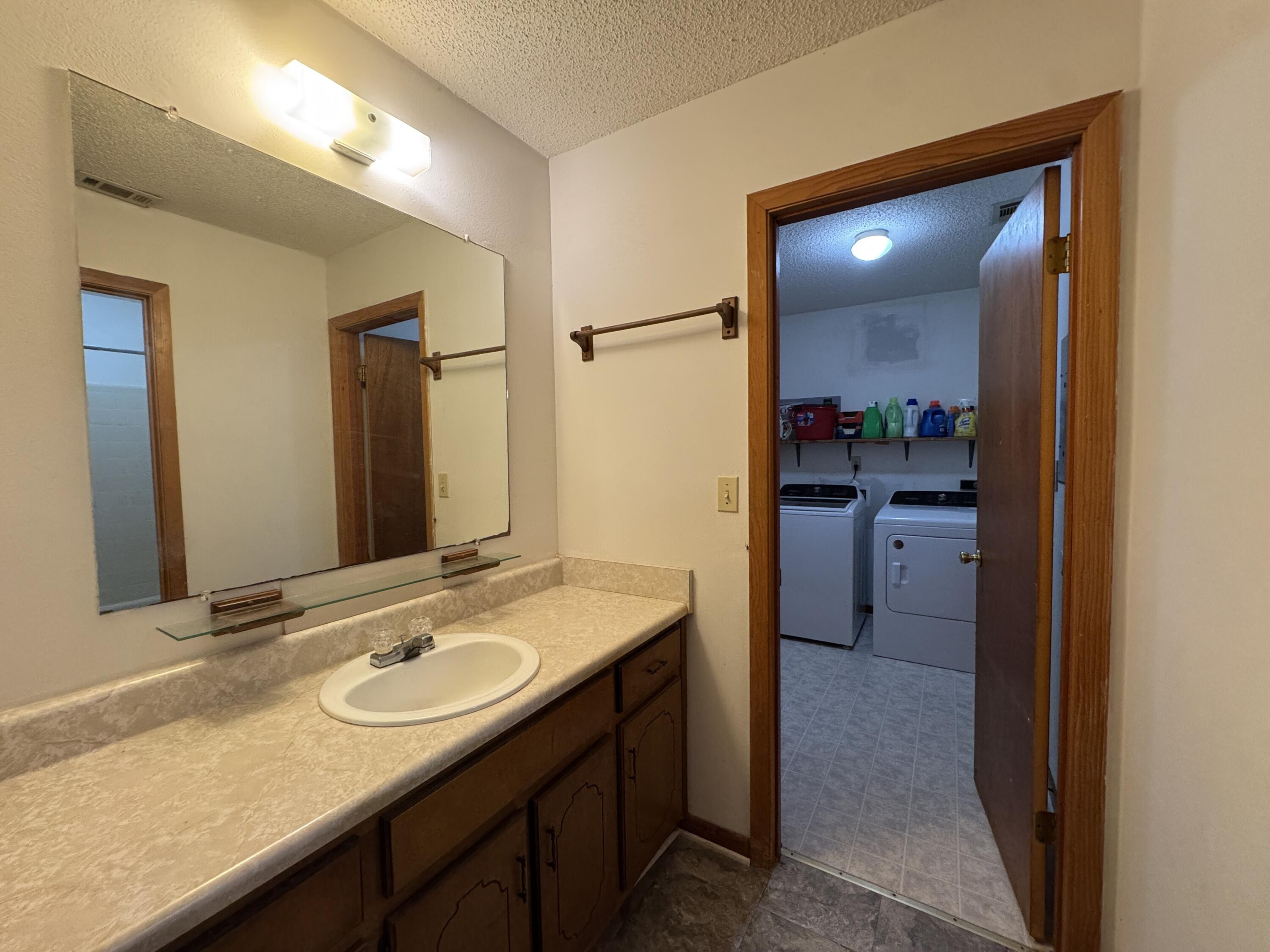 2928 Aplin Road Crestview, FL 32539 - Photo 14 of 42 a bathroom with a sink double vanity and a mirror