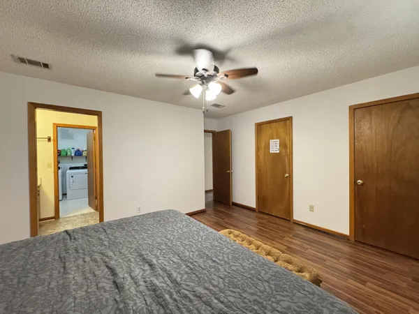 a bed room with a bed and a chandelier