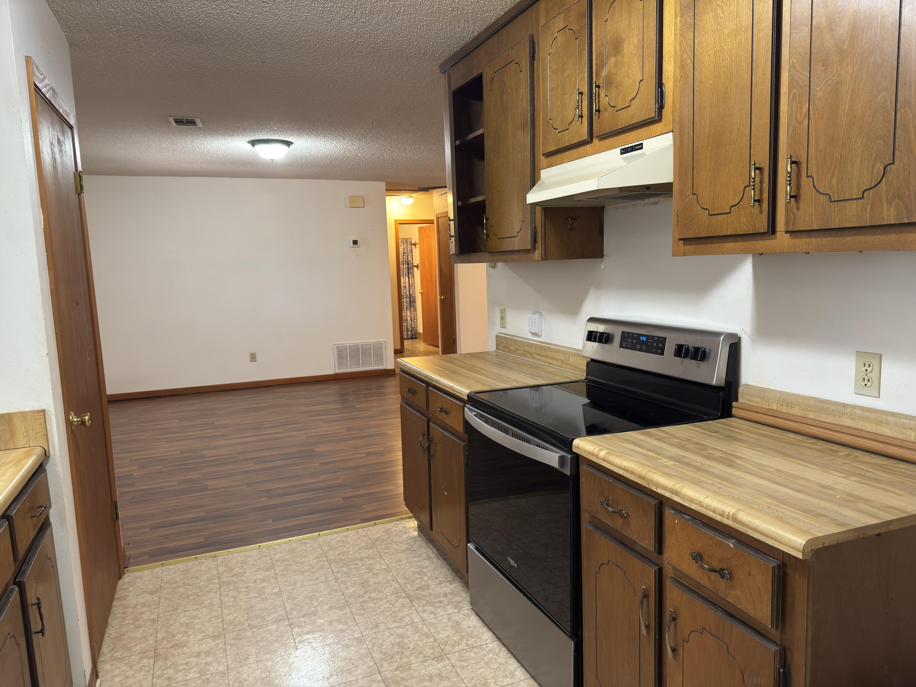 2928 Aplin Road Crestview, FL 32539 - Photo 10 of 42 a kitchen with stainless steel appliances granite countertop a stove a sink and a microwave