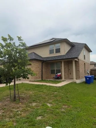 a view of a back yard of the house