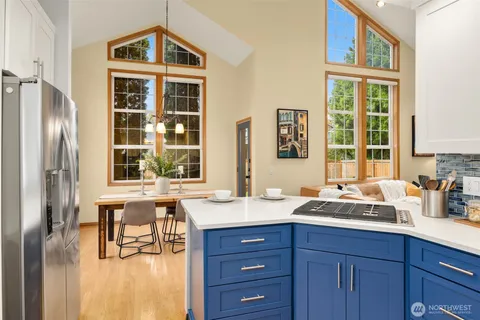 a kitchen with a sink stove and cabinets