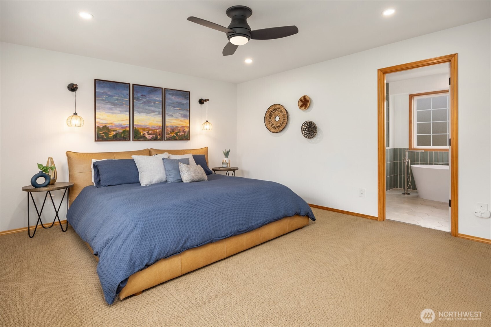 2714 182nd Place Southeast Bothell, WA 98012 - Photo 18 of 36 a bedroom with a large bed and a chandelier