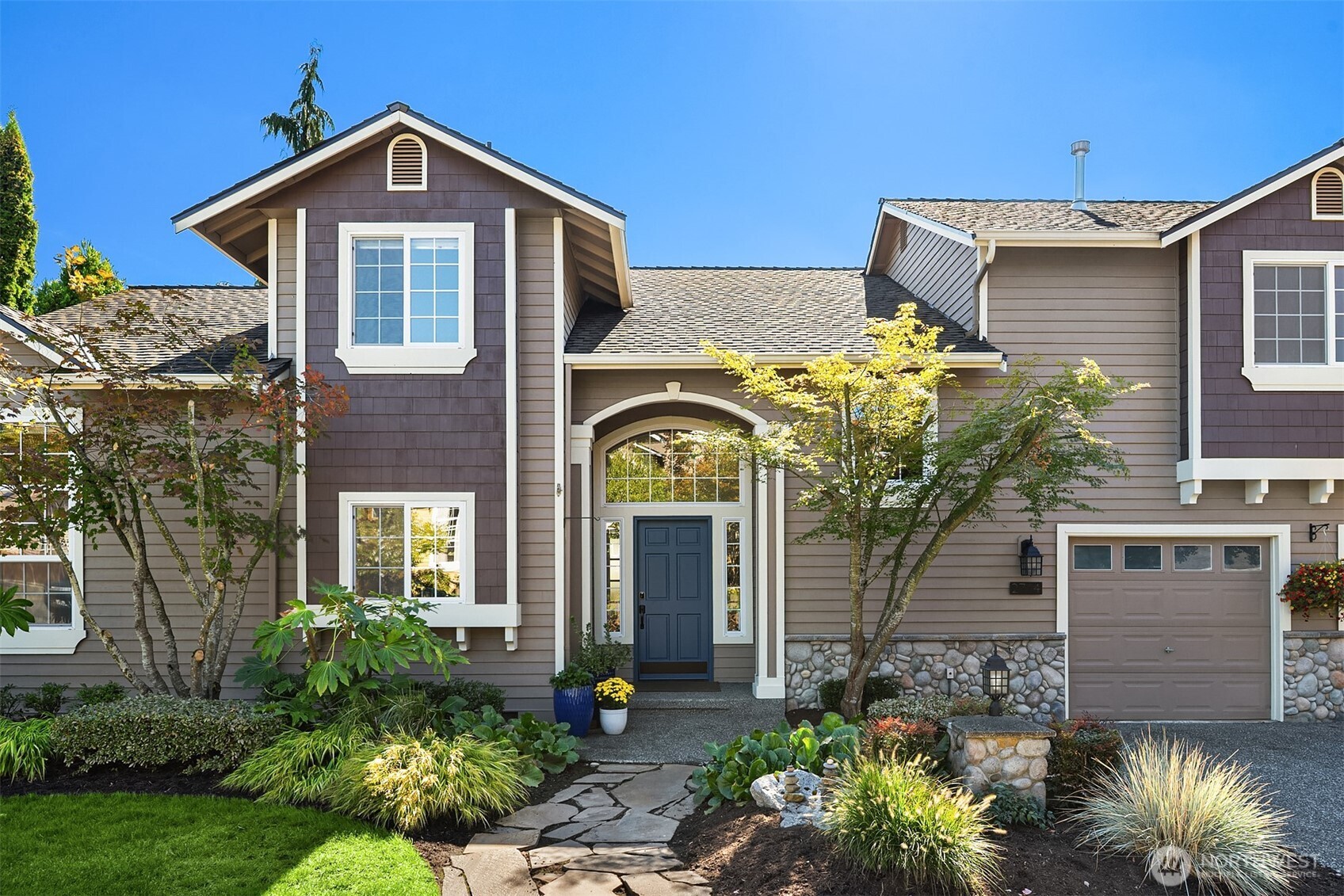 2714 182nd Place Southeast Bothell, WA 98012 - Photo 2 of 36 a front view of a house with a yard