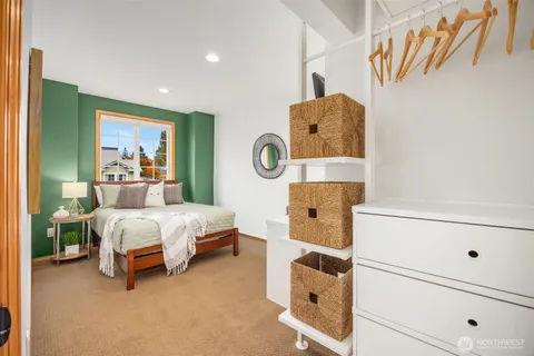 a bedroom with a bed and lamp