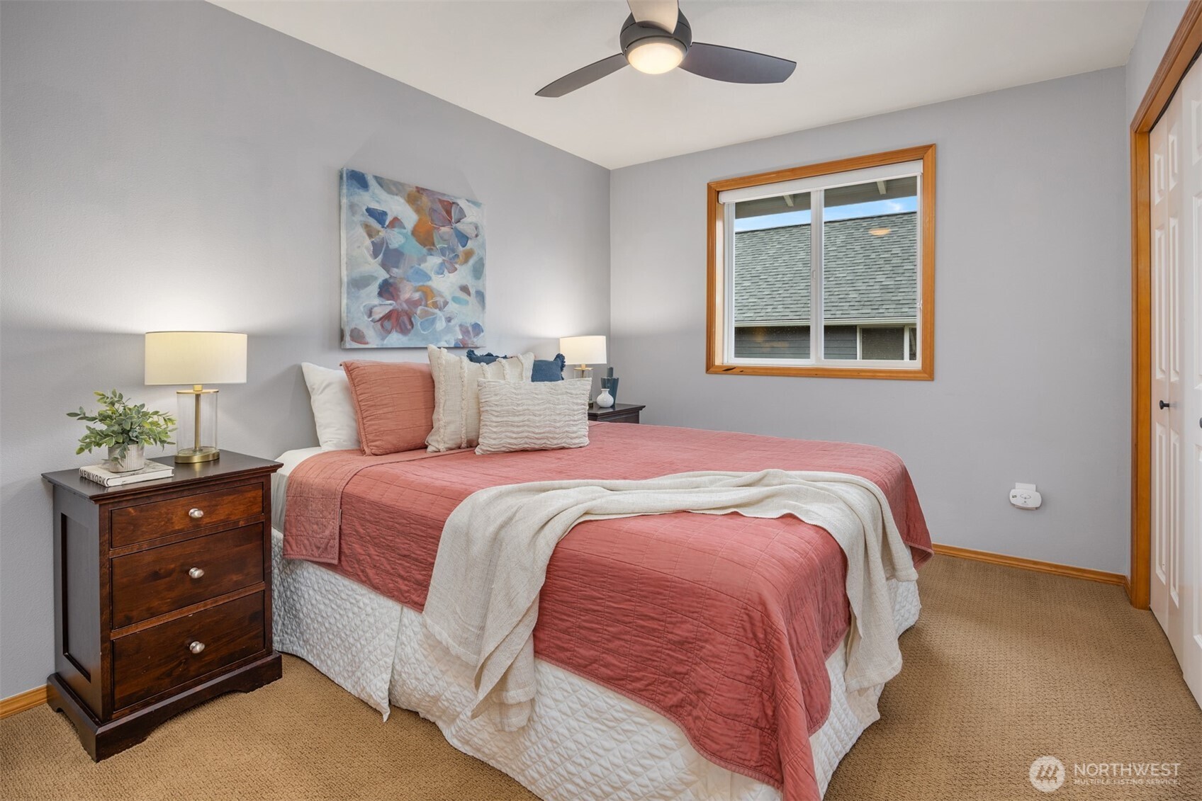 2714 182nd Place Southeast Bothell, WA 98012 - Photo 24 of 36 a bedroom with a bed and a painting on the wall
