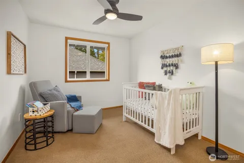 a bedroom with furniture and a window