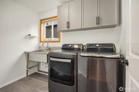 a kitchen with a stove and a sink