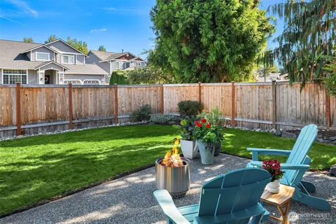 a view of yard with outdoor seating and green space