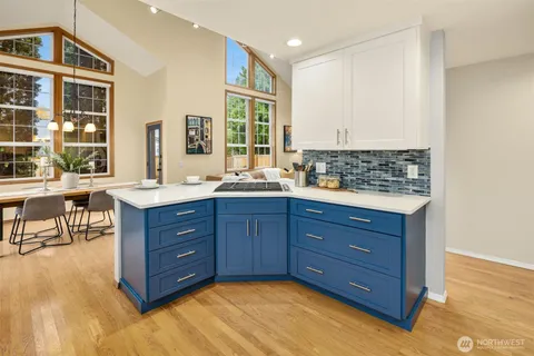 a room with a dresser and a window