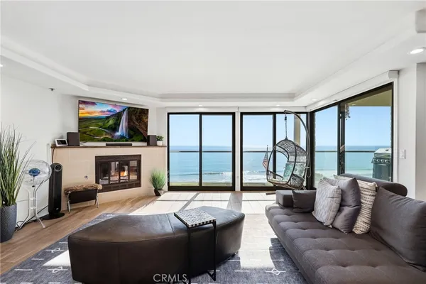 a living room with fireplace furniture and a flat screen tv
