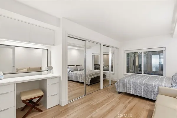a bathroom with a sink shower and a mirror