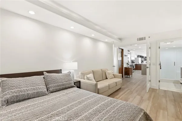 a bathroom with a sink toilet and mirror