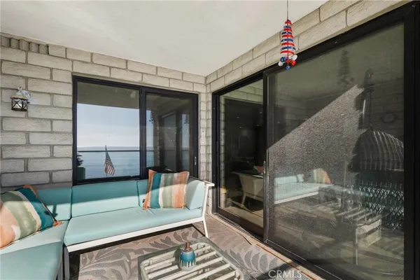 a living room with dining room and couches