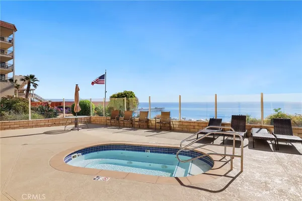 a view of a backyard with plants and a patio