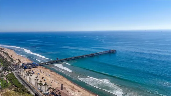 a view of a city that has tall buildings and a big yard