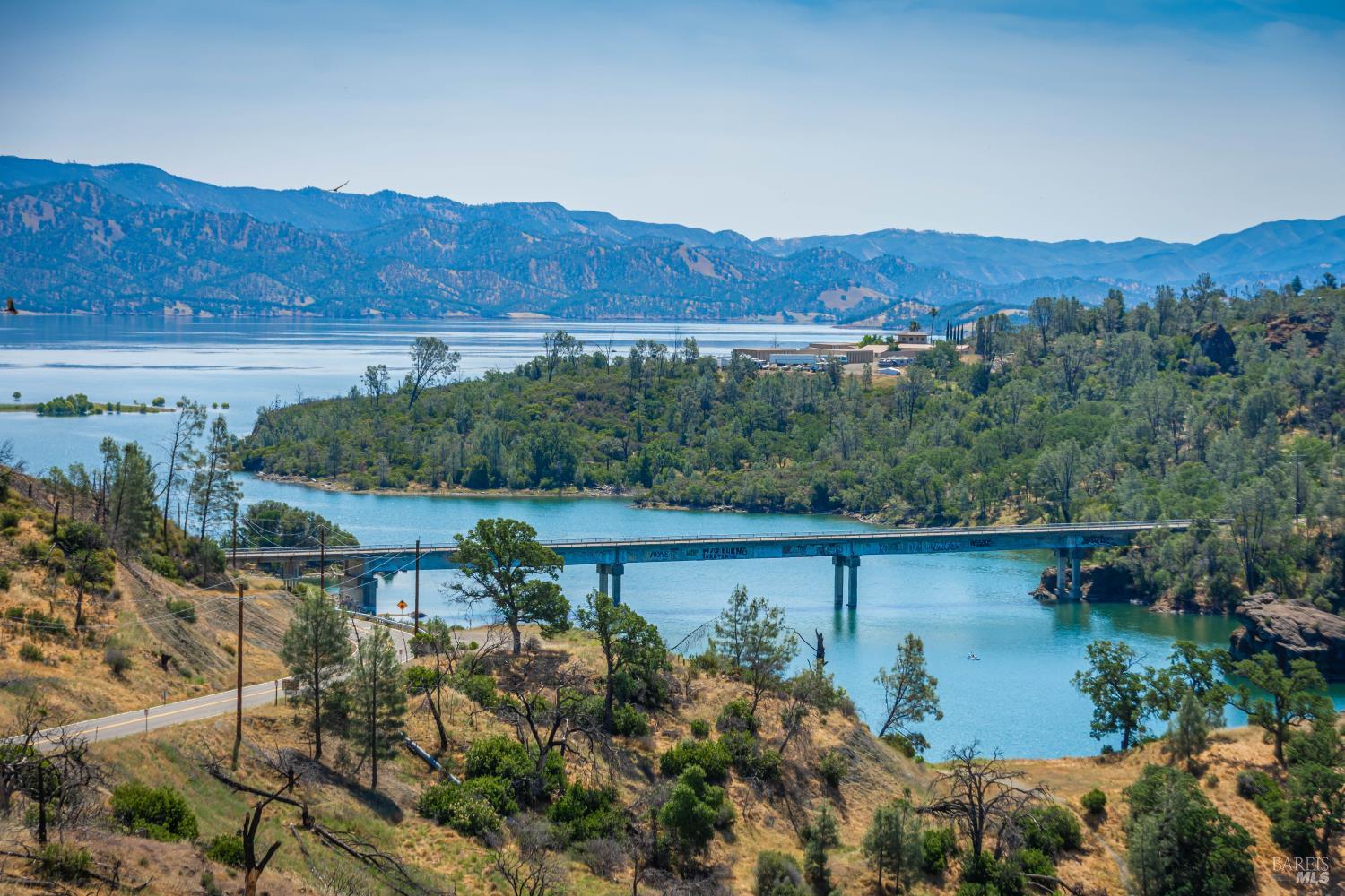 Panoramic views of Lake Berryessa and surrounding hills create an unforgettable backdrop for your future dream home.