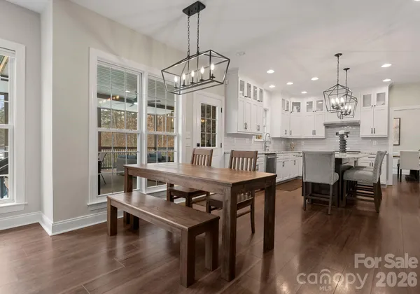 a bathroom with a toilet a sink and a mirror