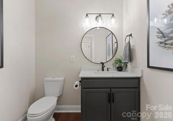 a kitchen with a refrigerator and a stove