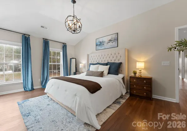 a bathroom with a bathtub sink and mirror