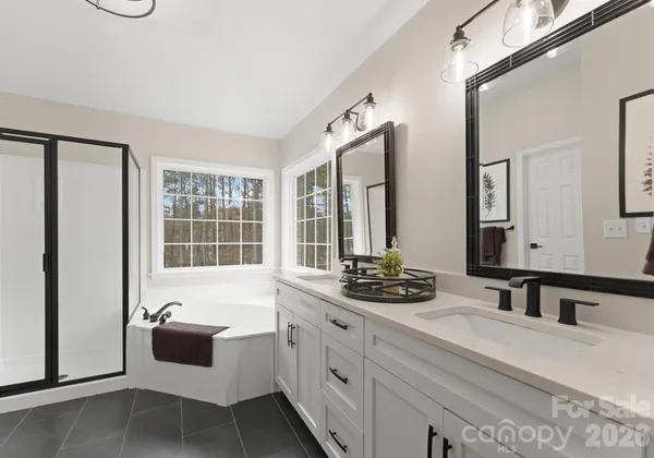 a bathroom with a tub and a window