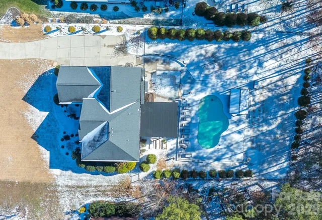 an aerial view of house with yard