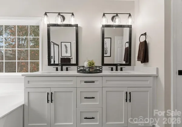 a living room with fireplace furniture and a window