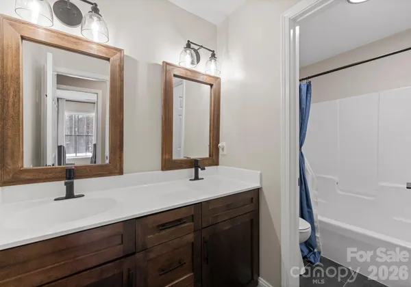 a view of a livingroom with furniture and a window