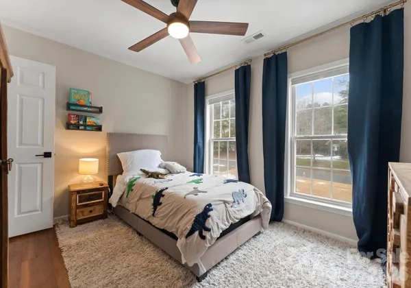 a front view of a house with garden and porch