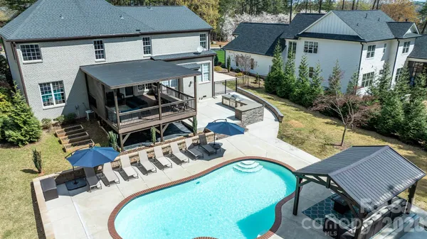 a view of a swimming pool with a patio