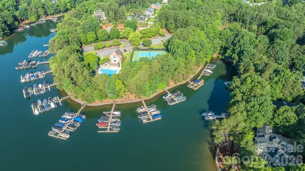 a view of swimming pool with a patio and garden