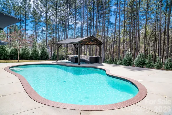 a building view with pool garden and outdoor space