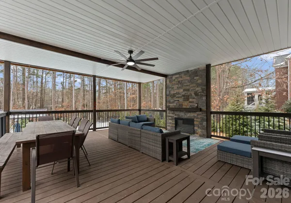 a view of staircase with wooden floor and a rug