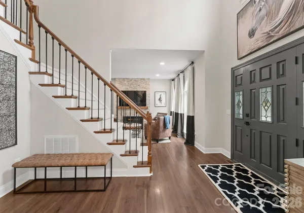 a room with furniture or chandelier and a wooden floor