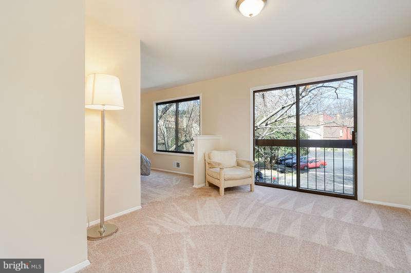 10907 Knights Bridge Court Reston, VA 20190 - Photo 12 of 24 a living room with furniture and a window