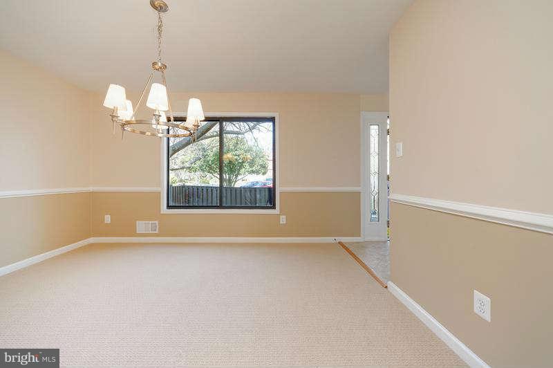 10907 Knights Bridge Court Reston, VA 20190 - Photo 3 of 24 a view of an empty room with a window