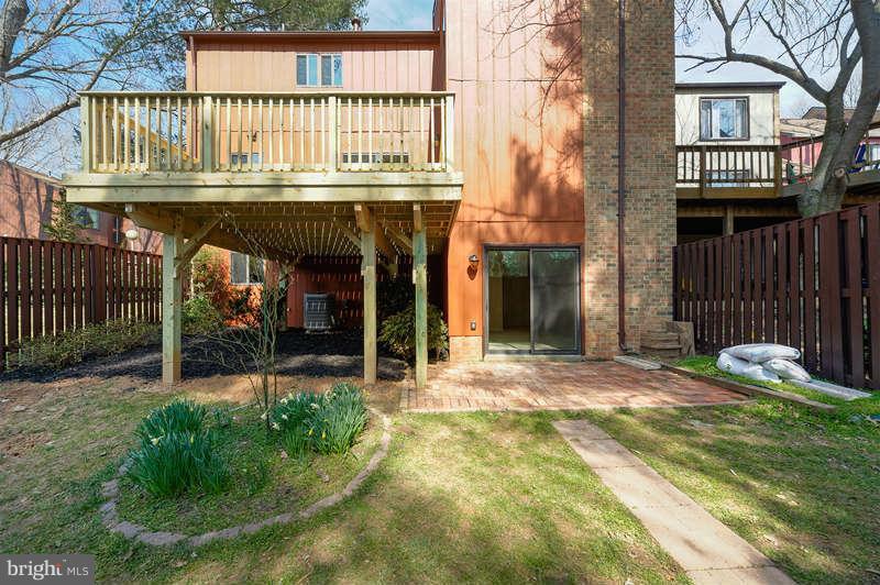 10907 Knights Bridge Court Reston, VA 20190 - Photo 21 of 24 a front view of a house with garden