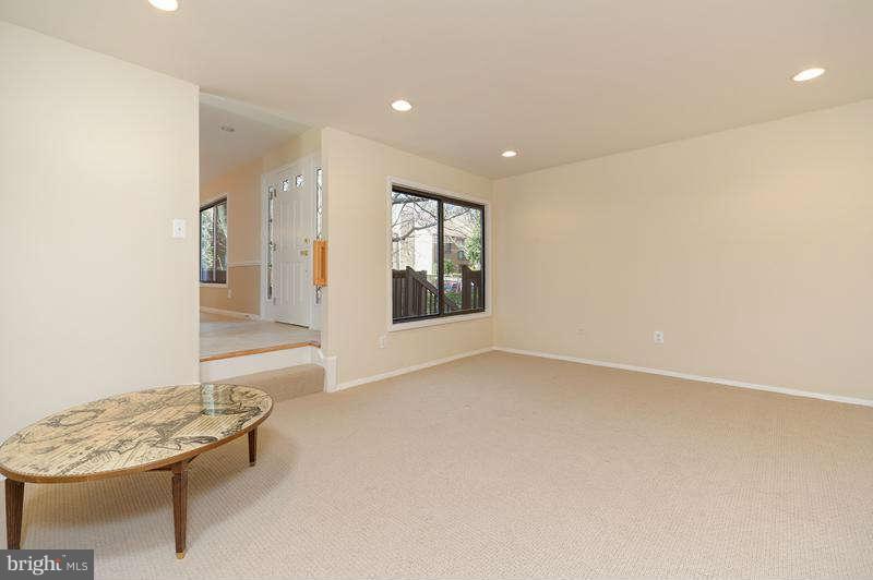 10907 Knights Bridge Court Reston, VA 20190 - Photo 4 of 24 a view of an empty room with a window