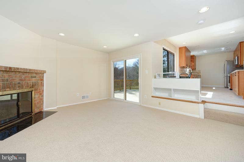 10907 Knights Bridge Court Reston, VA 20190 - Photo 6 of 24 a view of an empty room with a fireplace